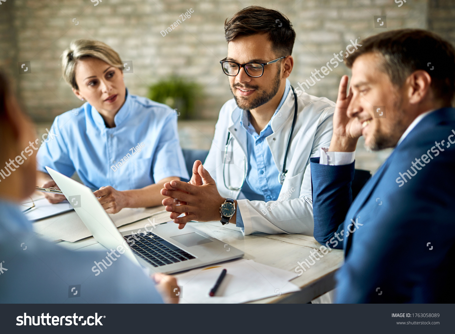 https://www.techneplus.com/wp-content/uploads/2023/01/stock-photo-group-of-healthcare-workers-and-businessman-using-laptop-while-having-a-meeting-in-the-office-1763058089.jpg